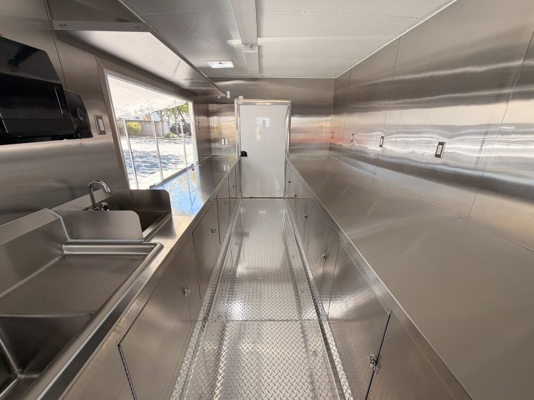18-ft school food trailer interior with clear central workflow aisle and service area