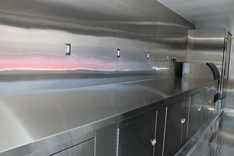 Stainless steel preparation counter inside the Avenal High School school food trailer