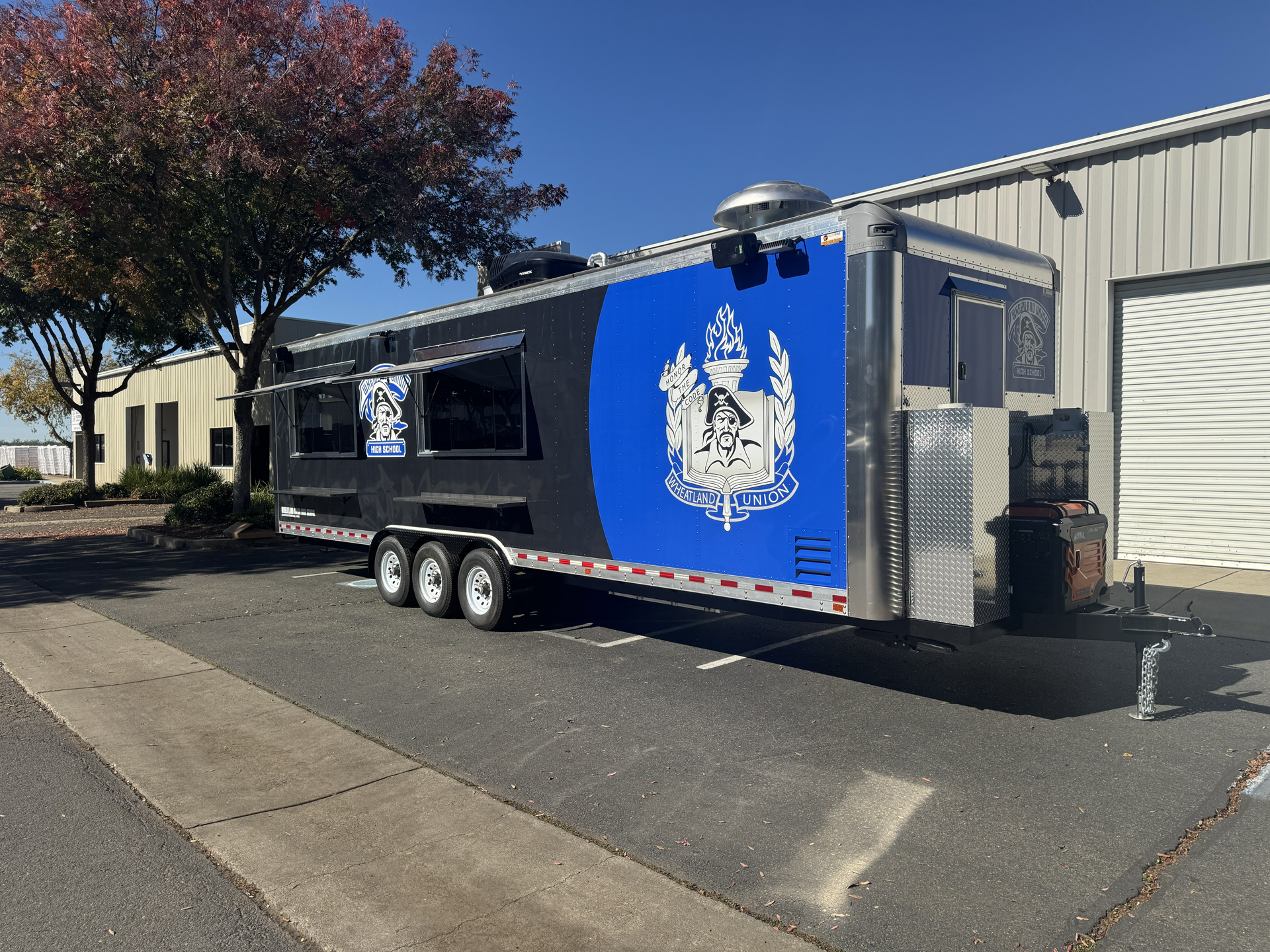 Custom school food trailer for Wheatland Union High School with service windows and branded exterior