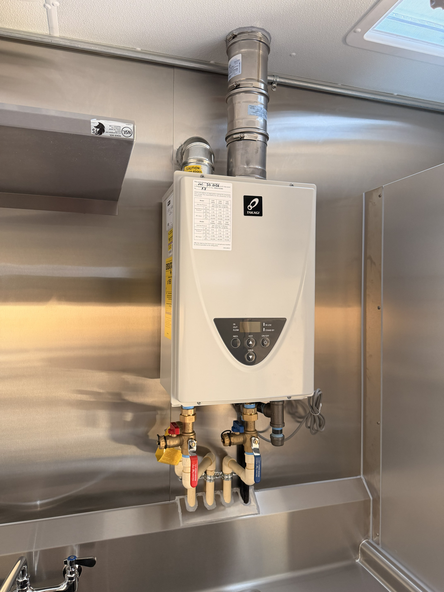 Commercial food trailer water heater and plumbing system