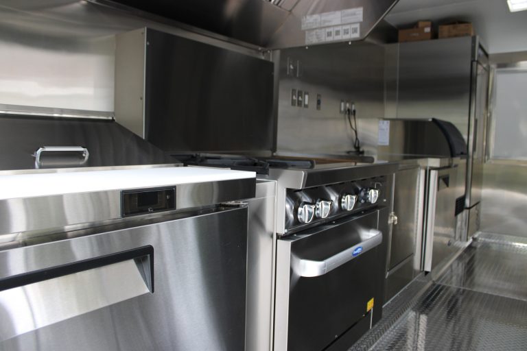 Commercial cooking equipment installed inside the custom 16ft coffee food trailer.