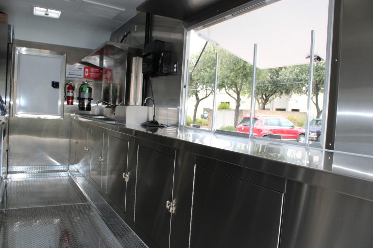 Commercial prep area and serving window inside the custom 16ft coffee food trailer.