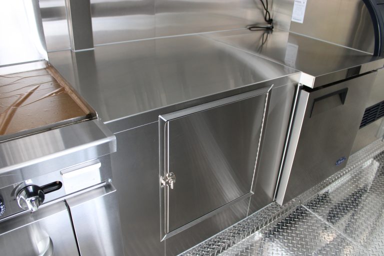 Stainless steel storage cabinet installed inside the custom 16ft coffee food trailer.