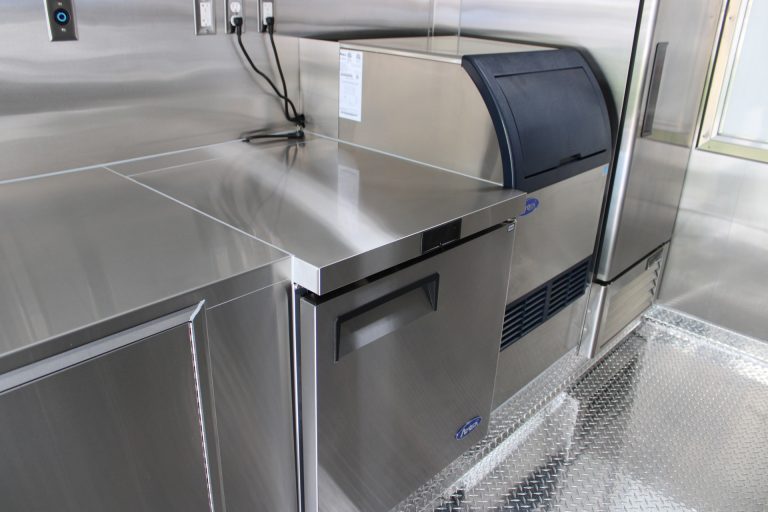 Commercial undercounter refrigerator installed inside the custom 16ft coffee food trailer.
