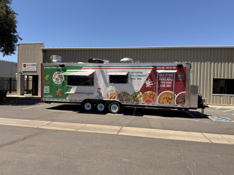 30-ft custom pizza food trailer with full wrap, service windows, and commercial mobile kitchen exterior