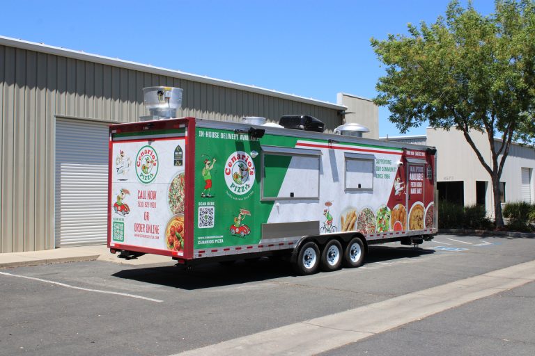 custom 30-ft pizza food trailer exterior with service windows, wrap graphics, and triple-axle configuration