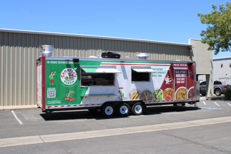 custom pizza food trailer exterior from rear service-side angle with wrap graphics and commercial service windows