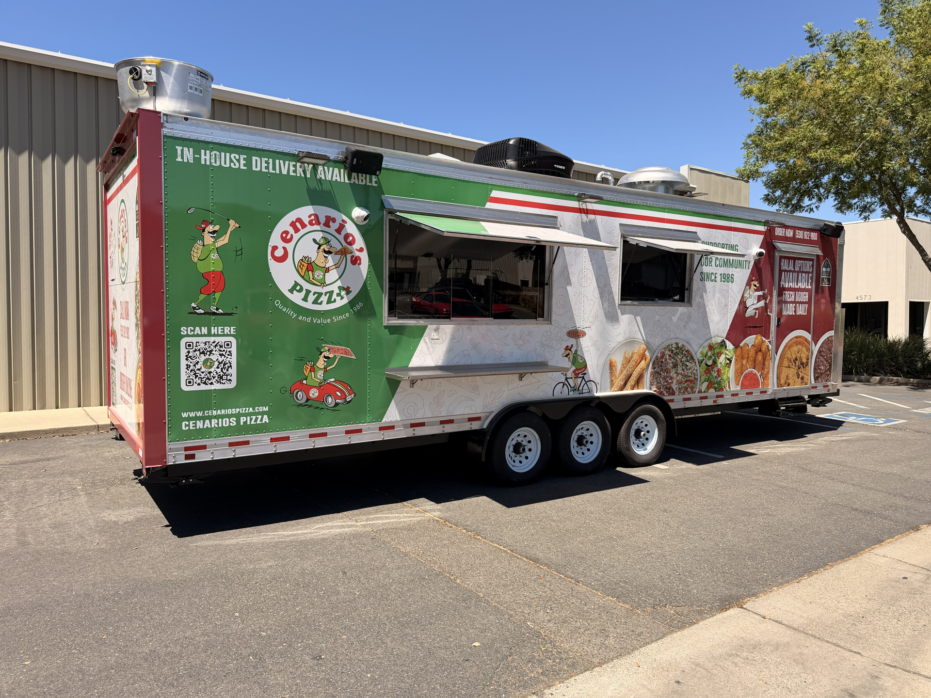 30-ft custom pizza food trailer with full branded wrap, dual service windows, exterior shelves, and commercial mobile kitchen setup