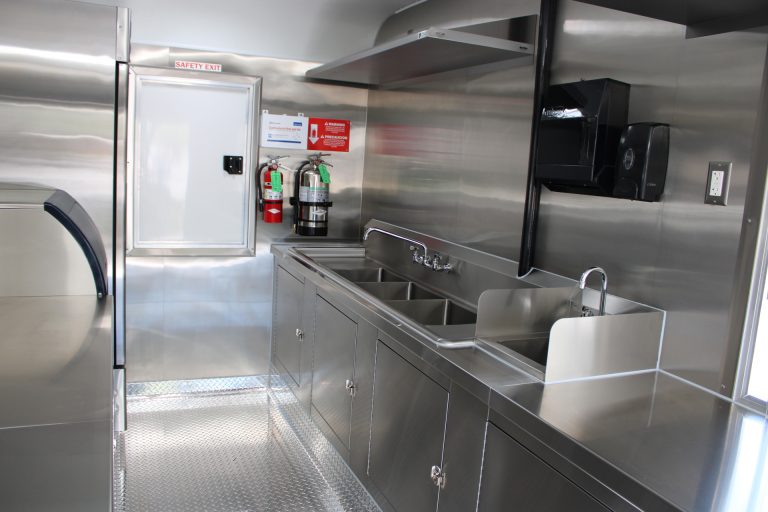 Stainless steel sink and sanitation area inside the Avenal High School school food trailer
