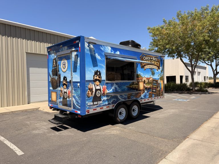 Three-quarter exterior view of the Avenal High School food trailer with open service window