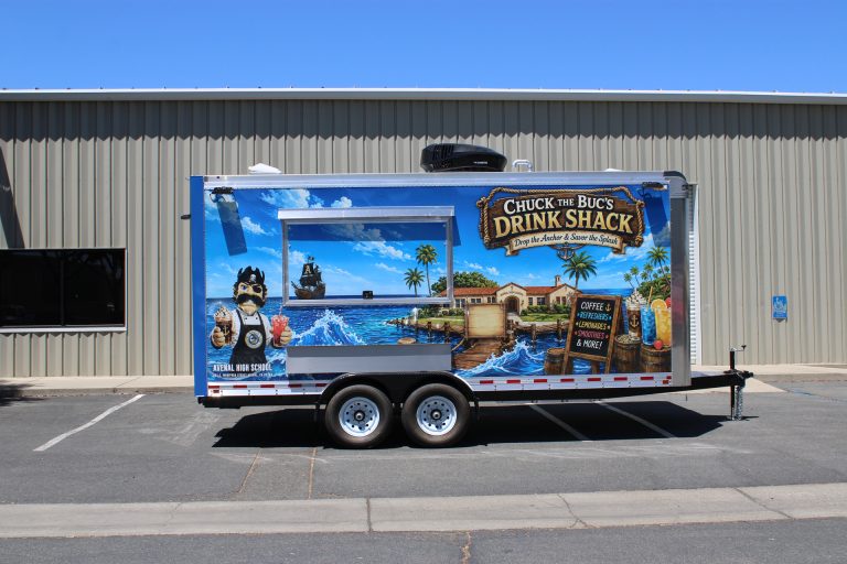 Side exterior of the Avenal High School school food trailer with large service window