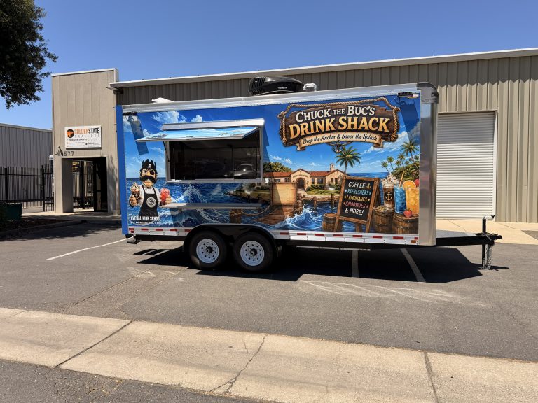 Side view of the Avenal High School school food trailer with service window and exterior shelf