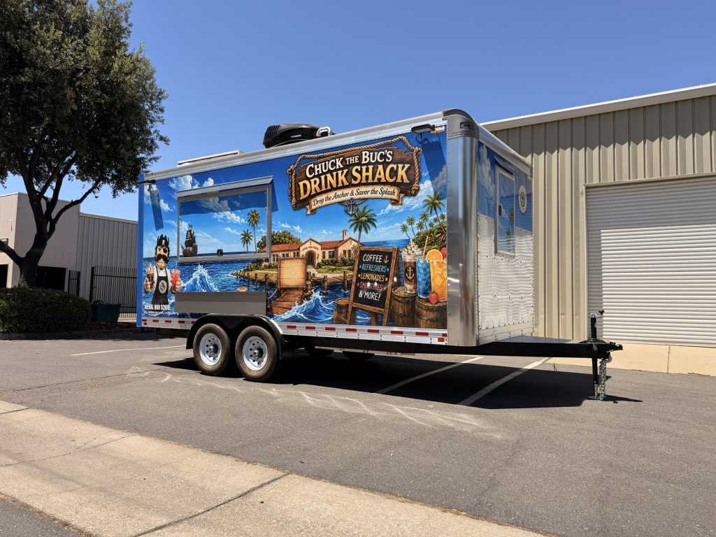 Wide exterior view of the Avenal High School 18-ft school food trailer with custom wrap