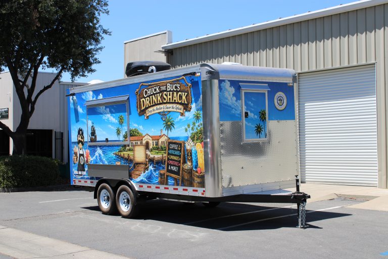 Rear three-quarter view of the Avenal High School food trailer with custom exterior graphics