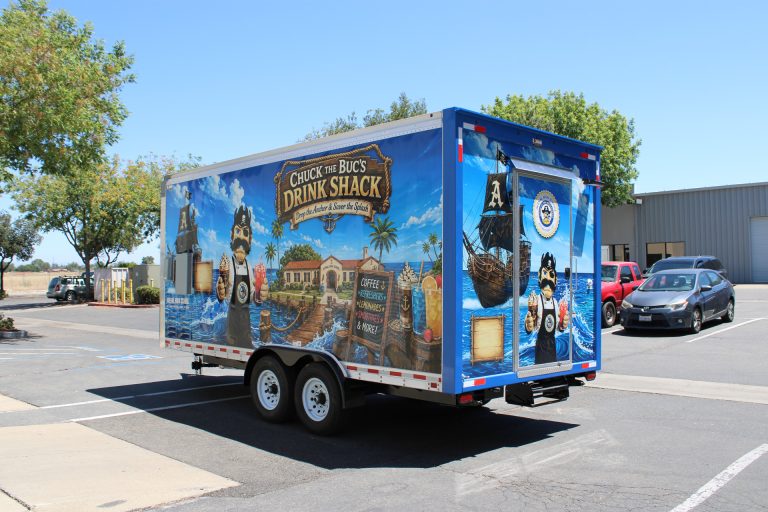 Three-quarter view of the Avenal High School food trailer with branded exterior and rooftop equipment
